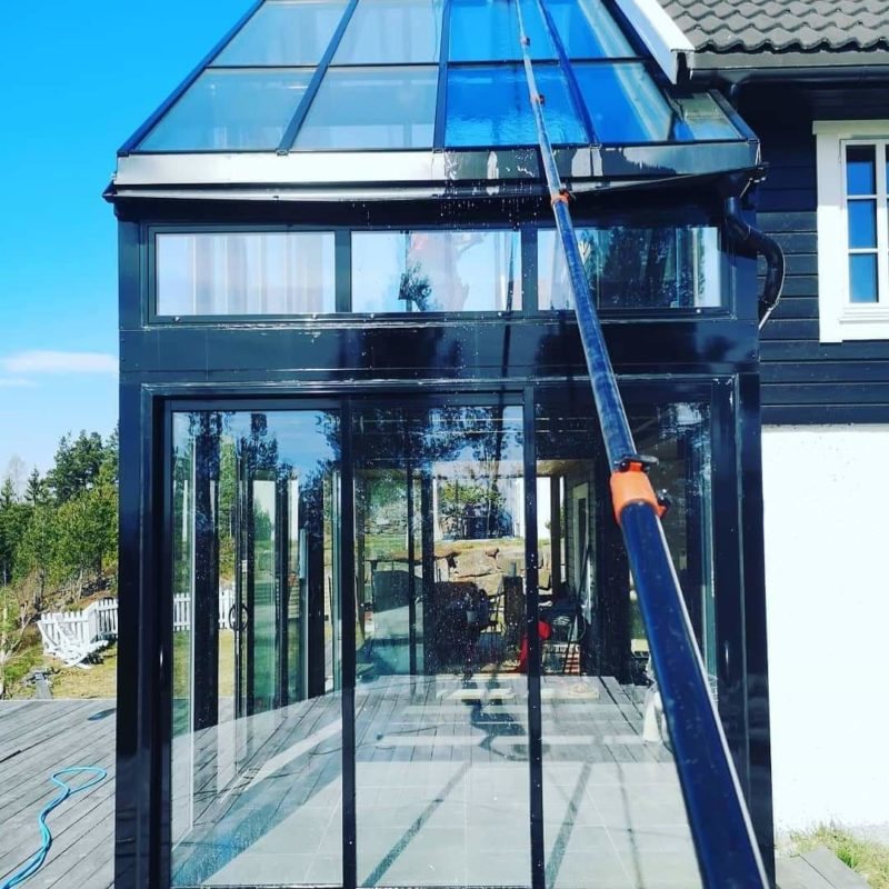 Veranda met glazen dak en telescoopstang
